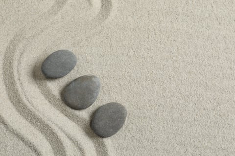 Stones on the sand with patterns — zen spa concept